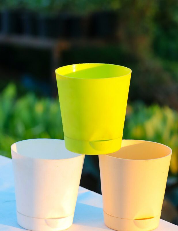 Krish self-watering plastic pots in green and ivory color with detachable water reservoir – indoor and outdoor planters by Vanupvan