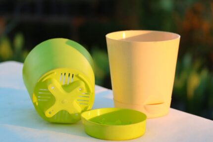 Krish self-watering plastic pots in green and ivory color with detachable water reservoir – indoor and outdoor planters by Vanupvan